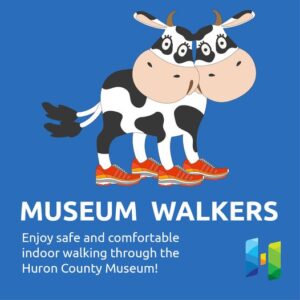 Illustrated image of a two-headed calf wearing running shoes on blue background. "Museum Walkers: enjoy safe, comfortable walking through the Huron County Museum." Museum logo in bottom right corner.